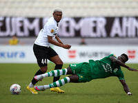 In Ta' Qali, Malta, on September 22, 2024, Franklin Sasere (R) of Floriana is challenged by Nunes Silva Pedro Henrique (L) of Hibernians dur...