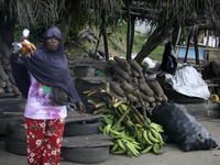 A woman displays local snacks at Akinola Market, Ipetu, as business activities boom along Ife-Ibadan Expressway in Osun State, Nigeria, on S...