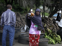 A woman displays local snacks at Akinola Market, Ipetu, as business activities boom along Ife-Ibadan Expressway in Osun State, Nigeria, on S...