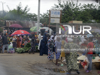 Business activities boom at Akinola Market, Ipetu, along Ife-Ibadan Expressway in Osun State, Nigeria, on September 20, 2024. Many city dwel...