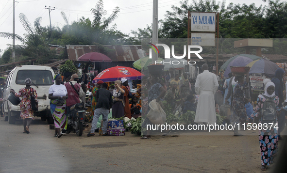 Business activities boom at Akinola Market, Ipetu, along Ife-Ibadan Expressway in Osun State, Nigeria, on September 20, 2024. Many city dwel...