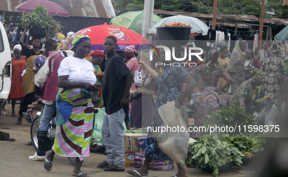 Business activities boom at Akinola Market, Ipetu, along Ife-Ibadan Expressway in Osun State, Nigeria, on September 20, 2024. Many city dwel...