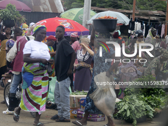 Business activities boom at Akinola Market, Ipetu, along Ife-Ibadan Expressway in Osun State, Nigeria, on September 20, 2024. Many city dwel...