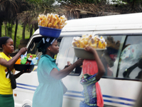 Hawkers approach travelers along Ife-Ibadan Expressway in Osun State, Nigeria, on September 20, 2024. Many city dwellers and travelers opt t...