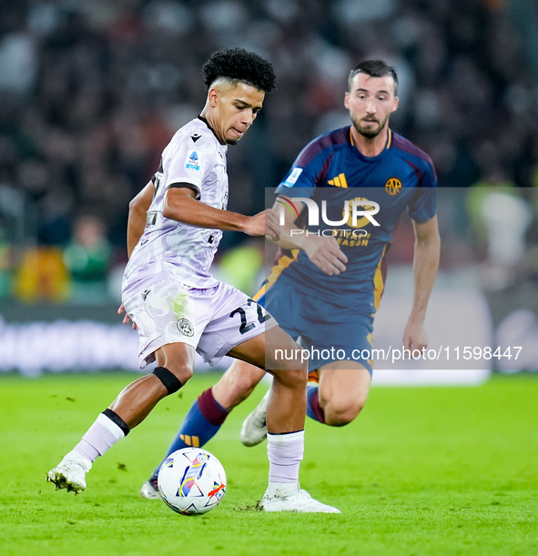 Brenner of Udinese Calcio and Bryan Cristante of AS Roma compete for the ball during the Serie A Enilive match between AS Roma and Udinese C...