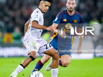 Brenner of Udinese Calcio and Bryan Cristante of AS Roma compete for the ball during the Serie A Enilive match between AS Roma and Udinese C...