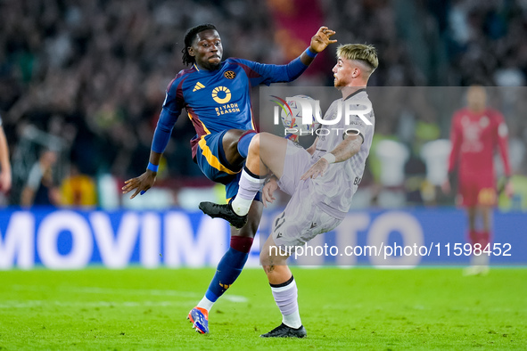 Iker Bravo of Udinese Calcio and Manu Kone' of AS Roma compete for the ball during the Serie A Enilive match between AS Roma and Udinese Cal...