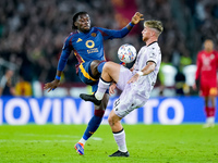 Iker Bravo of Udinese Calcio and Manu Kone' of AS Roma compete for the ball during the Serie A Enilive match between AS Roma and Udinese Cal...