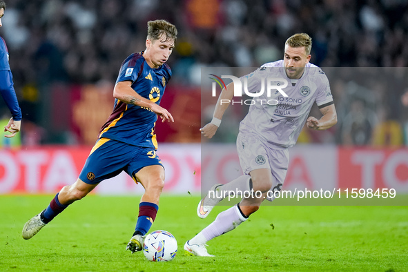 Tommaso Baldanzi of AS Roma and Sandi Lovric of Udinese Calcio compete for the ball during the Serie A Enilive match between AS Roma and Udi...