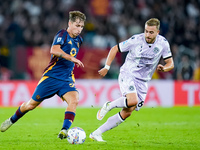 Tommaso Baldanzi of AS Roma and Sandi Lovric of Udinese Calcio compete for the ball during the Serie A Enilive match between AS Roma and Udi...