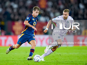 Tommaso Baldanzi of AS Roma and Sandi Lovric of Udinese Calcio compete for the ball during the Serie A Enilive match between AS Roma and Udi...