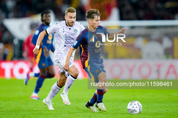 Tommaso Baldanzi of AS Roma and Sandi Lovric of Udinese Calcio compete for the ball during the Serie A Enilive match between AS Roma and Udi...