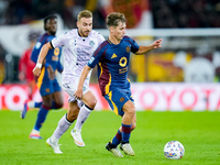 Tommaso Baldanzi of AS Roma and Sandi Lovric of Udinese Calcio compete for the ball during the Serie A Enilive match between AS Roma and Udi...