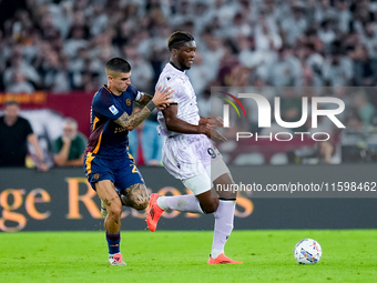 Gianluca Mancini of AS Roma and Isaak Toure' of Udinese Calcio compete for the ball during the Serie A Enilive match between AS Roma and Udi...