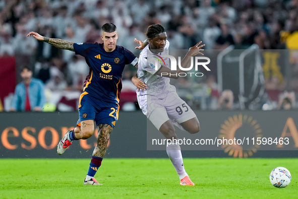 Gianluca Mancini of AS Roma and Isaak Toure' of Udinese Calcio compete for the ball during the Serie A Enilive match between AS Roma and Udi...