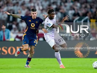 Gianluca Mancini of AS Roma and Isaak Toure' of Udinese Calcio compete for the ball during the Serie A Enilive match between AS Roma and Udi...