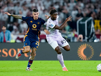 Gianluca Mancini of AS Roma and Isaak Toure' of Udinese Calcio compete for the ball during the Serie A Enilive match between AS Roma and Udi...