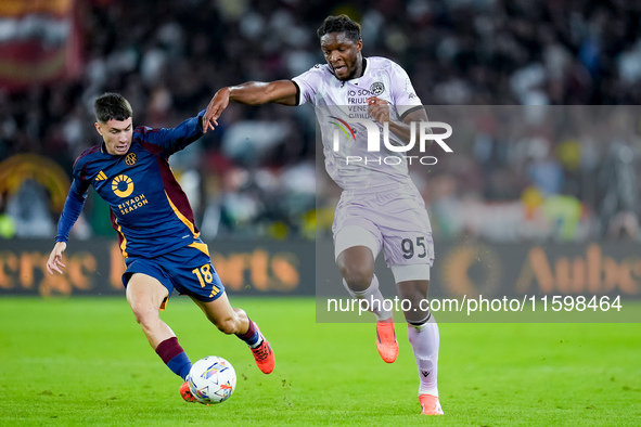 Matias Soule' of AS Roma and Isaak Toure' of Udinese Calcio compete for the ball during the Serie A Enilive match between AS Roma and Udines...