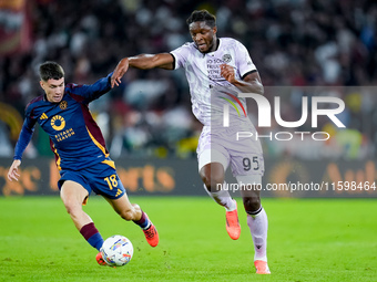 Matias Soule' of AS Roma and Isaak Toure' of Udinese Calcio compete for the ball during the Serie A Enilive match between AS Roma and Udines...