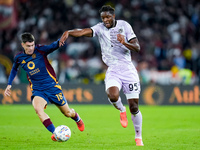 Matias Soule' of AS Roma and Isaak Toure' of Udinese Calcio compete for the ball during the Serie A Enilive match between AS Roma and Udines...