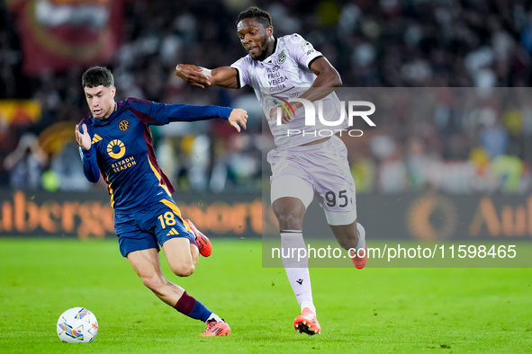 Matias Soule' of AS Roma and Isaak Toure' of Udinese Calcio compete for the ball during the Serie A Enilive match between AS Roma and Udines...