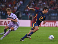 Thomas Thiesson Kristensen of Udinese Calcio and Paulo Dybala of A.S. Roma are in action during the 5th day of the Serie A Championship betw...