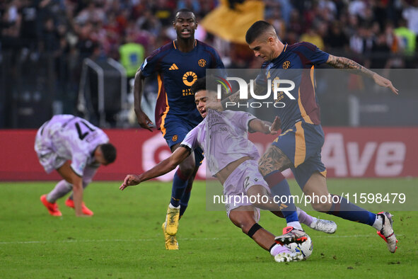 Brenner of Udinese Calcio and Gianluca Mancini of A.S. Roma are in action during the 5th day of the Serie A Championship between A.S. Roma a...