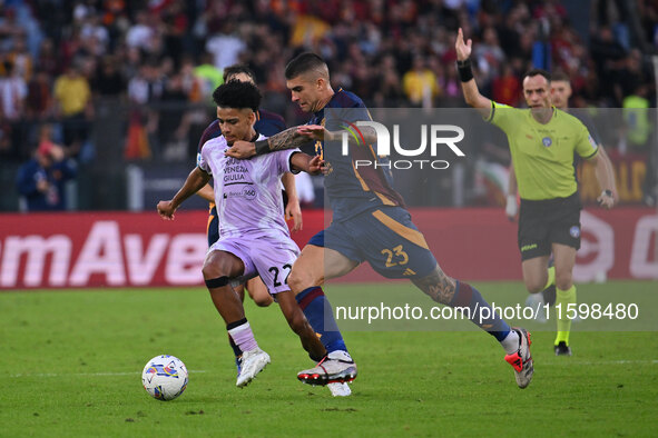 Brenner of Udinese Calcio and Gianluca Mancini of A.S. Roma are in action during the 5th day of the Serie A Championship between A.S. Roma a...