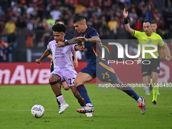 Brenner of Udinese Calcio and Gianluca Mancini of A.S. Roma are in action during the 5th day of the Serie A Championship between A.S. Roma a...