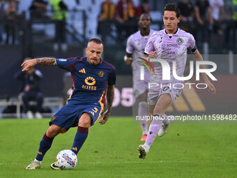 Angelino of A.S. Roma and Florian Thauvin of Udinese Calcio are in action during the 5th day of the Serie A Championship between A.S. Roma a...