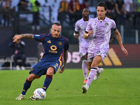 Angelino of A.S. Roma and Florian Thauvin of Udinese Calcio are in action during the 5th day of the Serie A Championship between A.S. Roma a...