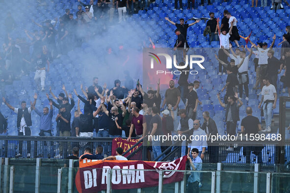 Supporters of A.S. Roma take action during the 5th day of the Serie A Championship between A.S. Roma and Udinese Calcio at the Olympic Stadi...