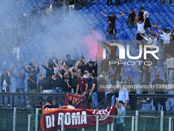 Supporters of A.S. Roma take action during the 5th day of the Serie A Championship between A.S. Roma and Udinese Calcio at the Olympic Stadi...