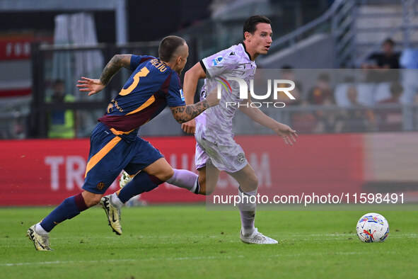 Angelino of A.S. Roma and Florian Thauvin of Udinese Calcio are in action during the 5th day of the Serie A Championship between A.S. Roma a...