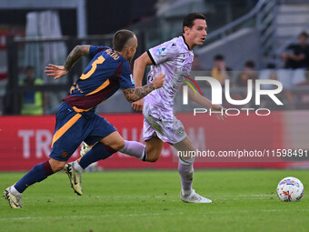 Angelino of A.S. Roma and Florian Thauvin of Udinese Calcio are in action during the 5th day of the Serie A Championship between A.S. Roma a...