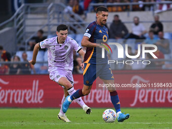 Florian Thauvin of Udinese Calcio and Lorenzo Pellegrini of A.S. Roma are in action during the 5th day of the Serie A Championship between A...