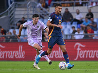 Florian Thauvin of Udinese Calcio and Lorenzo Pellegrini of A.S. Roma are in action during the 5th day of the Serie A Championship between A...