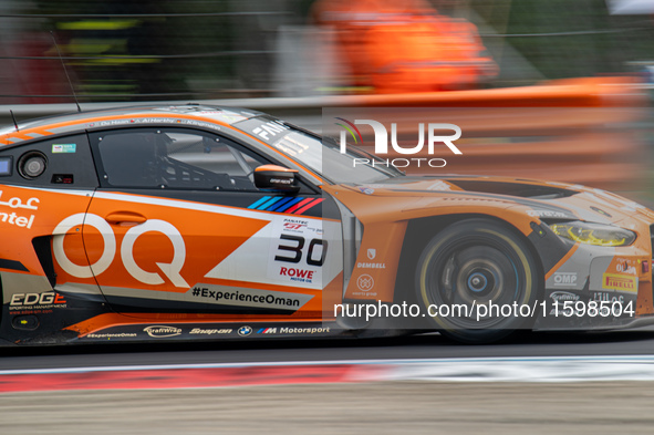 Jens Klingmann, Ahmad Al Harthy, and Sam De Haan of the team OQ by Oman Racing drive a BMW M4 GT3 during qualifying of the Fanatec GT World...