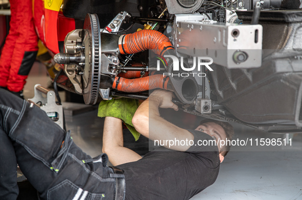 A mechanic of the AF Corse - Francorchamps Motors team works during the Fanatec GT World Challenge in Monza, on September 22, 2024. 