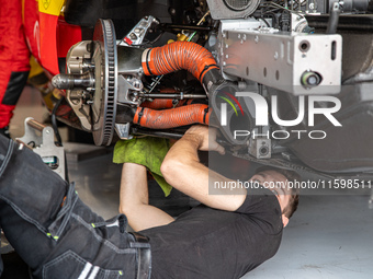 A mechanic of the AF Corse - Francorchamps Motors team works during the Fanatec GT World Challenge in Monza, on September 22, 2024. (