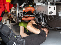 A mechanic of the AF Corse - Francorchamps Motors team works during the Fanatec GT World Challenge in Monza, on September 22, 2024. (