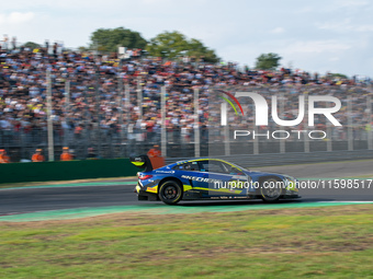 Maxime Martin, Raffaele Marciello, and Valentino Rossi of Team WRT drive a BMW M4 GT3 during the Fanatec GT World Challenge in Monza, on Sep...