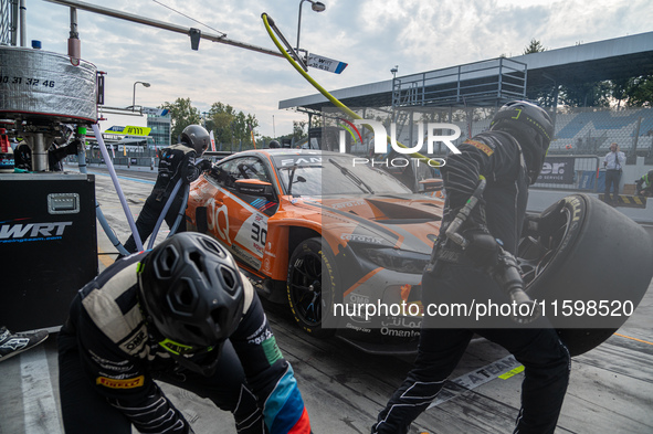 Jens Klingmann, Ahmad Al Harthy, and Sam De Haan of the team OQ by Oman Racing perform a pit stop on a BMW M4 GT3 during the Fanatec GT Worl...