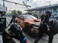 Jens Klingmann, Ahmad Al Harthy, and Sam De Haan of the team OQ by Oman Racing perform a pit stop on a BMW M4 GT3 during the Fanatec GT Worl...