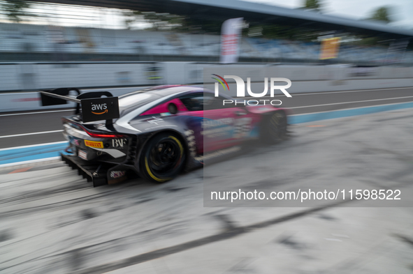 Mex Jansen, Tim Creswick, and Ben Green of the Walkenhorst Motorsport team exit the pit stop in an Aston Martin Vantage AMR GT3 EVO during t...