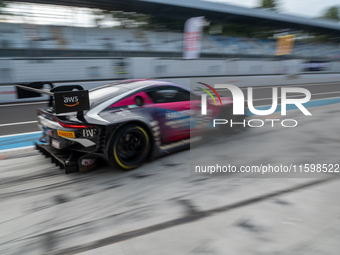 Mex Jansen, Tim Creswick, and Ben Green of the Walkenhorst Motorsport team exit the pit stop in an Aston Martin Vantage AMR GT3 EVO during t...