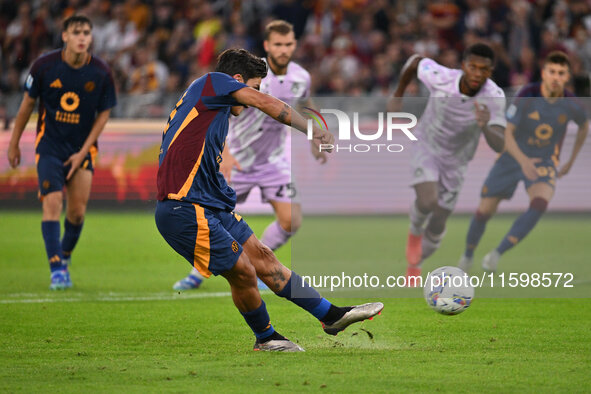 Paulo Dybala of A.S. Roma scores the 2-0 goal during the 5th day of the Serie A Championship between A.S. Roma and Udinese Calcio at the Oly...