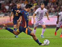 Paulo Dybala of A.S. Roma scores the 2-0 goal during the 5th day of the Serie A Championship between A.S. Roma and Udinese Calcio at the Oly...