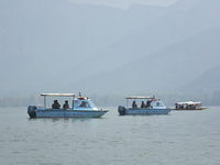 Indian troopers remain alert as the National Conference, a regional political party, holds a boat rally ahead of the second phase of assembl...