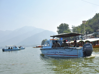 Indian troopers remain alert as the National Conference, a regional political party, holds a boat rally ahead of the second phase of assembl...